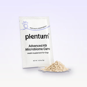 Plentum Advanced K9 Microbiome Care sachet with a pile of the daily dog supplement powder